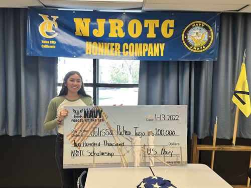 Julissa Pacheco-Trejo with Scholarship Check